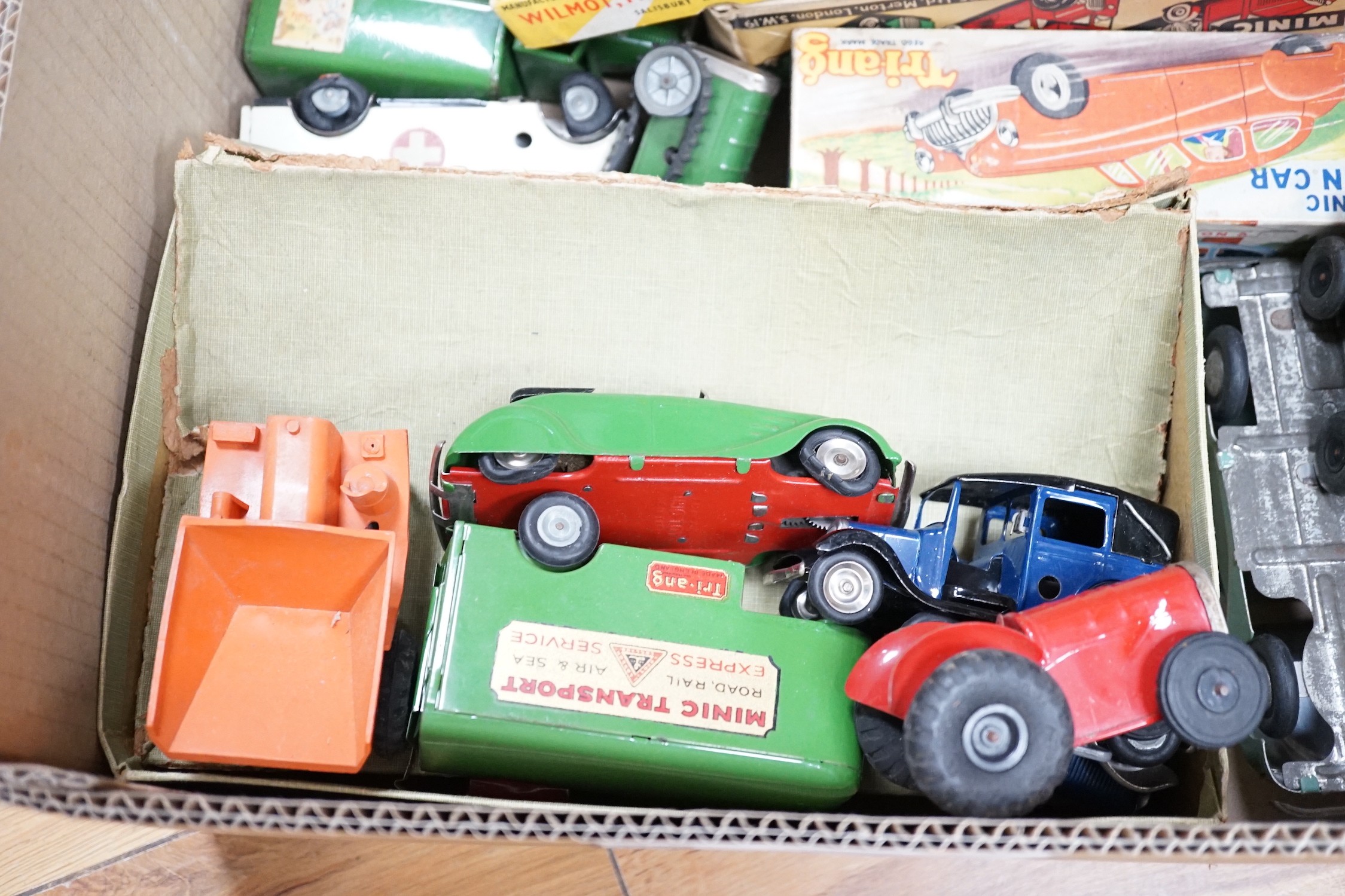 A collection of tin plate model vehicles, to include a boxed Tri-ang model of a Vauxhall Cabriolet & caravan from the Minic clockwork toys collection, and others
